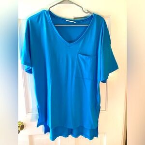 Zenana high low hem short sleeved shirt with front pocket and raw edge hems